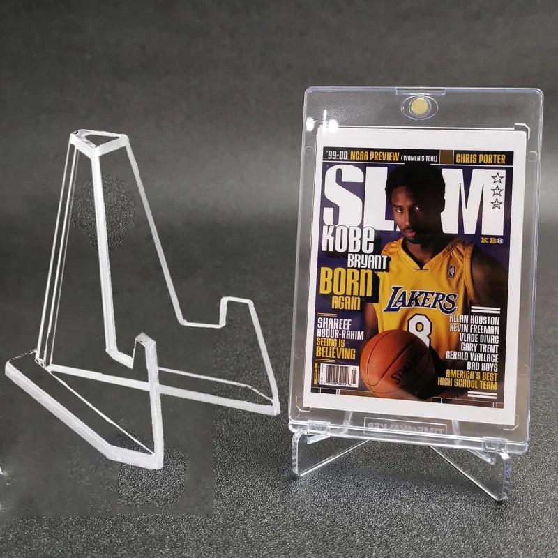Clear acrylic triangle easel stand displaying a Kobe Bryant basketball card.