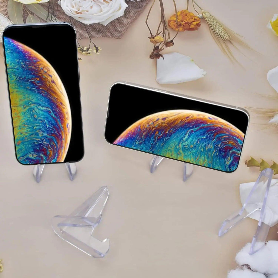 Clear acrylic triangle easels displaying two smartphones with vibrant, swirling abstract screens on a light background.