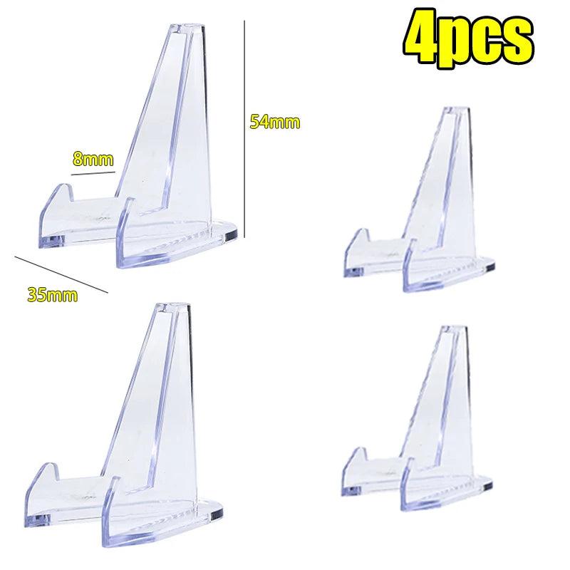 Four clear acrylic triangle easel stands, 54x35mm, for displaying crystals.