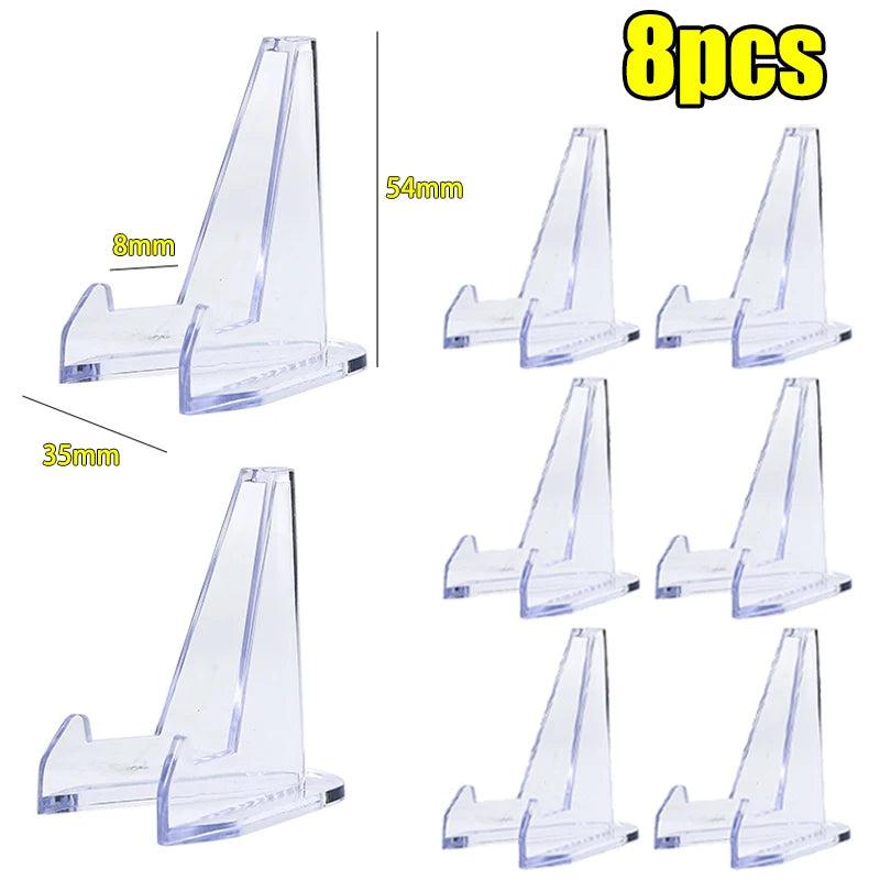 Eight clear acrylic triangle easel stands, 54x35mm, for displaying crystals or stones.