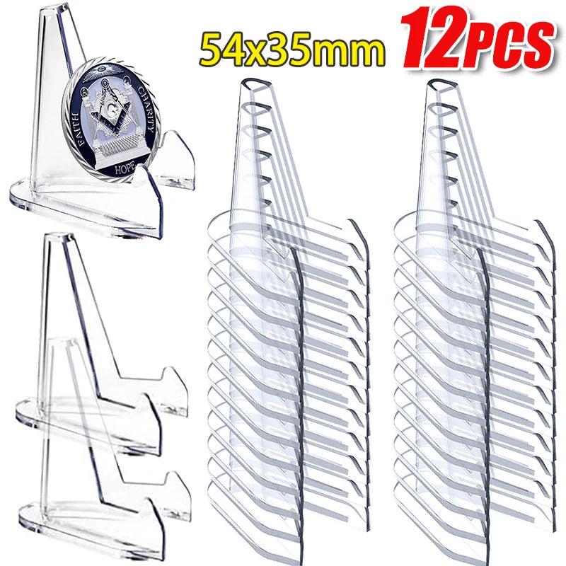 Clear acrylic triangle easel stands, 54x35mm, displaying a coin and stacked for crystals.
