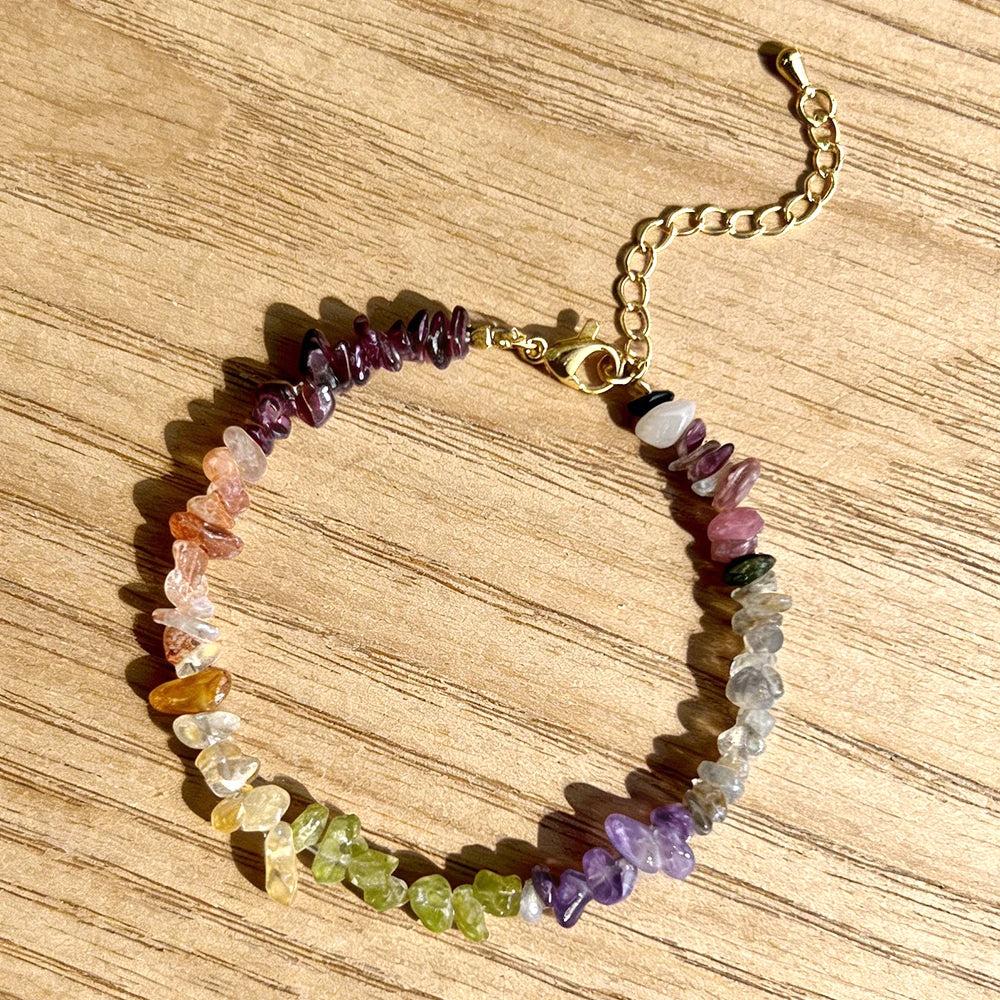 Bohemian Mixed Gemstone Crystal Chip Chakra Bracelet with Garnet, Amethyst, and Peridot, featuring a gold lobster clasp.