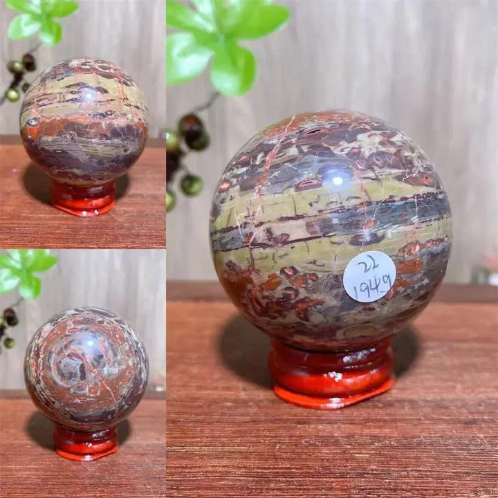 Polished Money Agate Crystal Sphere, a unique abundance stone with vibrant gold, rust, and warm brown banding.