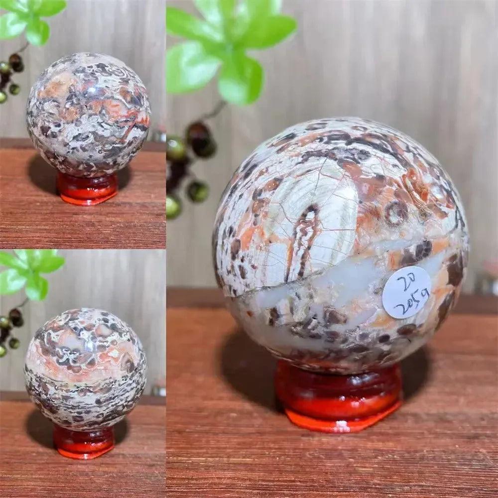 Polished Money Agate Crystal Sphere, showcasing unique gold, rust, cream, and warm brown banding for abundance.