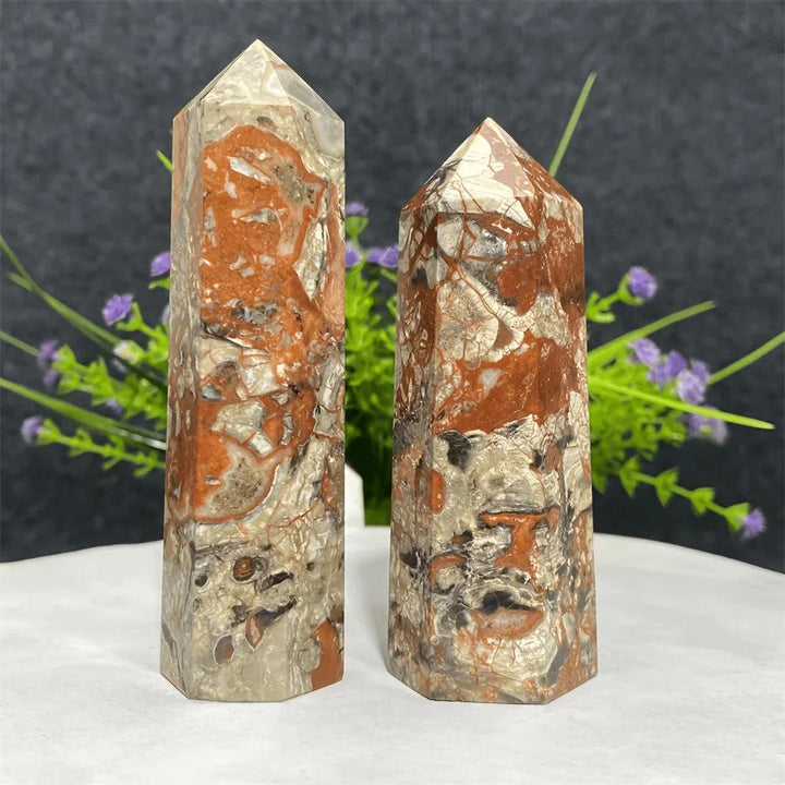 Two Money Agate Crystal Towers in earthy red and grey tones for grounding and abundance.