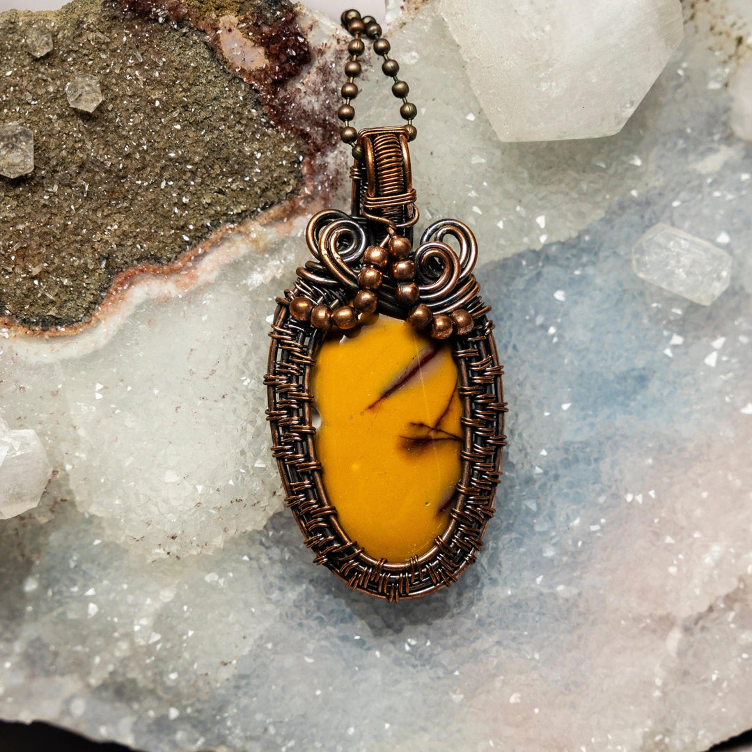 Mookaite Jasper 2.5" wire wrap pendant, featuring a sunset-hued stone in handcrafted copper, grounding and confidence.