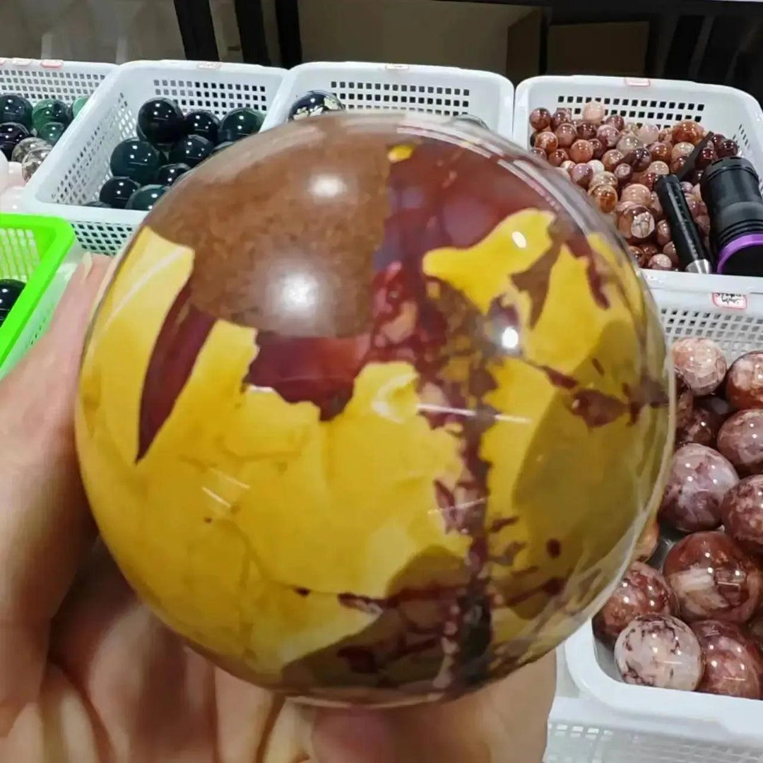 Crystal Destiny Mookaite Jasper sphere, hand-polished with earthy reds, creamy ivories, and sun-warmed golds.