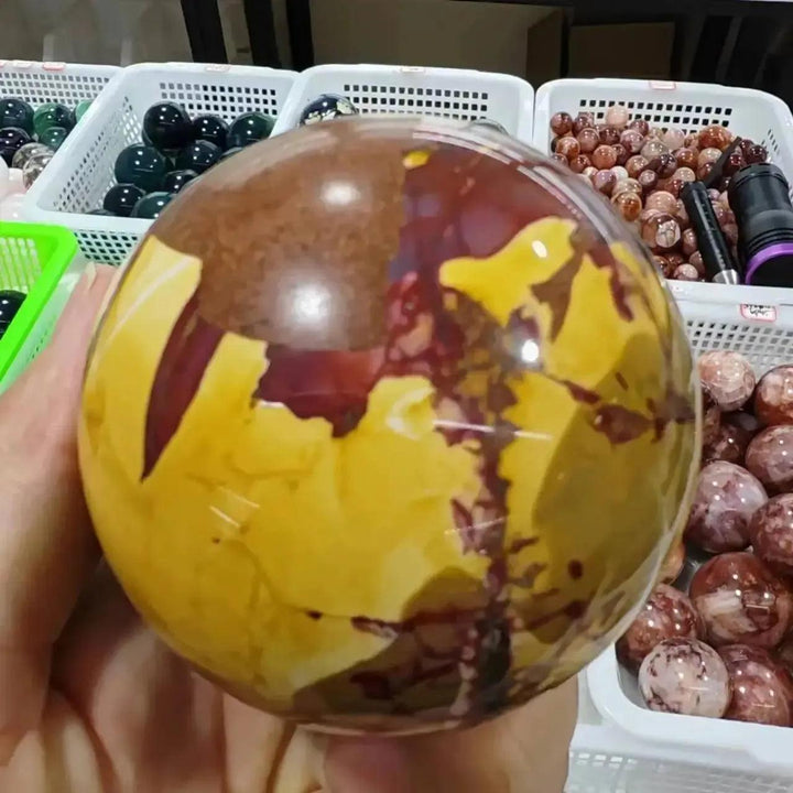 Crystal Destiny Mookaite Jasper sphere, hand-polished with earthy reds, creamy ivories, and sun-warmed golds.