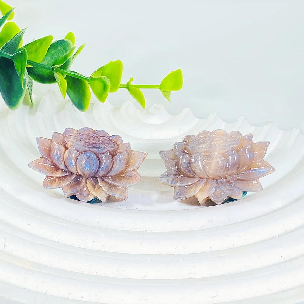 Two Moonstone crystal lotus flower carvings with soft adularescent glow, perfect for meditation and peaceful energy.