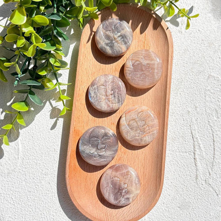 Moonstone Crystal Sun and Moon Face Carving, showcasing pearlescent glow and intuitive energy.