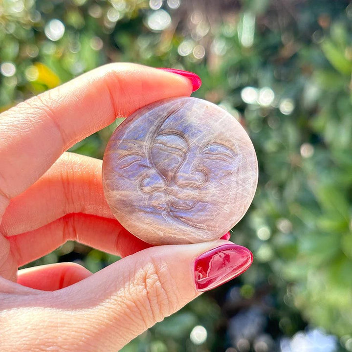 Moonstone Crystal Sun and Moon Face Carving, showcasing its pearlescent glow and duality for intuition and new beginnings.