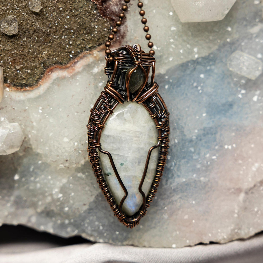 2.75" Moonstone Wire Wrap Pendant, handcrafted in healing copper, showcasing its adularescent glow.