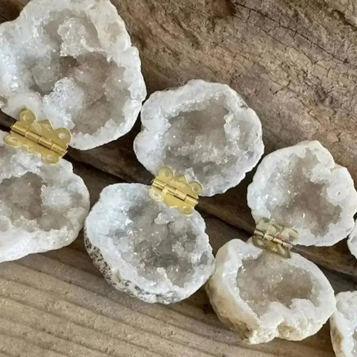 Crystal Destiny Moroccan Agate Geode "Ring" Boxes with sparkling druzy quartz and gold hinges on wood.