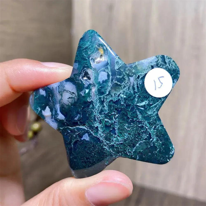 Hand-carved Moss Agate Star Crystal Carving, a natural green healing stone for new beginnings and abundance.