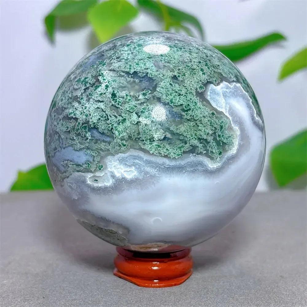 Moss Agate Sphere 78mm: Translucent chalcedony with green moss-like inclusions, hand-polished for grounded beauty.