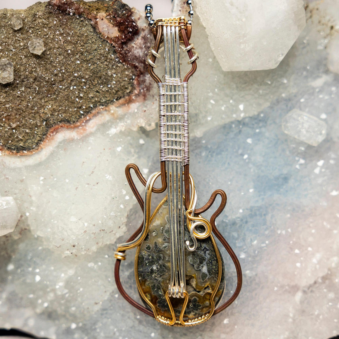 Handcrafted Moss Agate Guitar Wire Wrap Pendant: copper and silver wire, unique green inclusions, 3.6-inch, Heart Chakra.