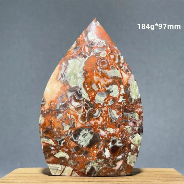 Moss Agate freeform torch from Crystal Destiny, featuring green dendritic inclusions and earthy red-orange hues.