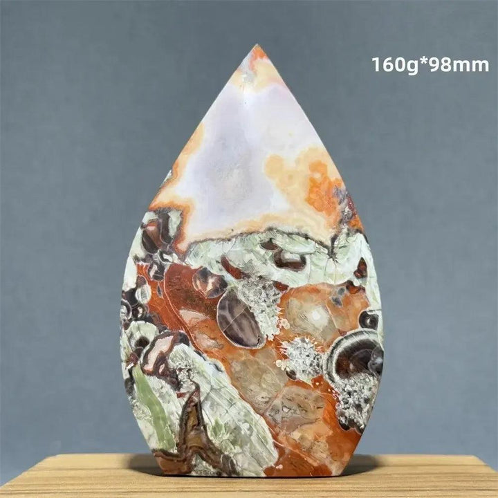 Polished Moss Agate freeform torch from Crystal Destiny, featuring green, orange, and white dendritic inclusions.