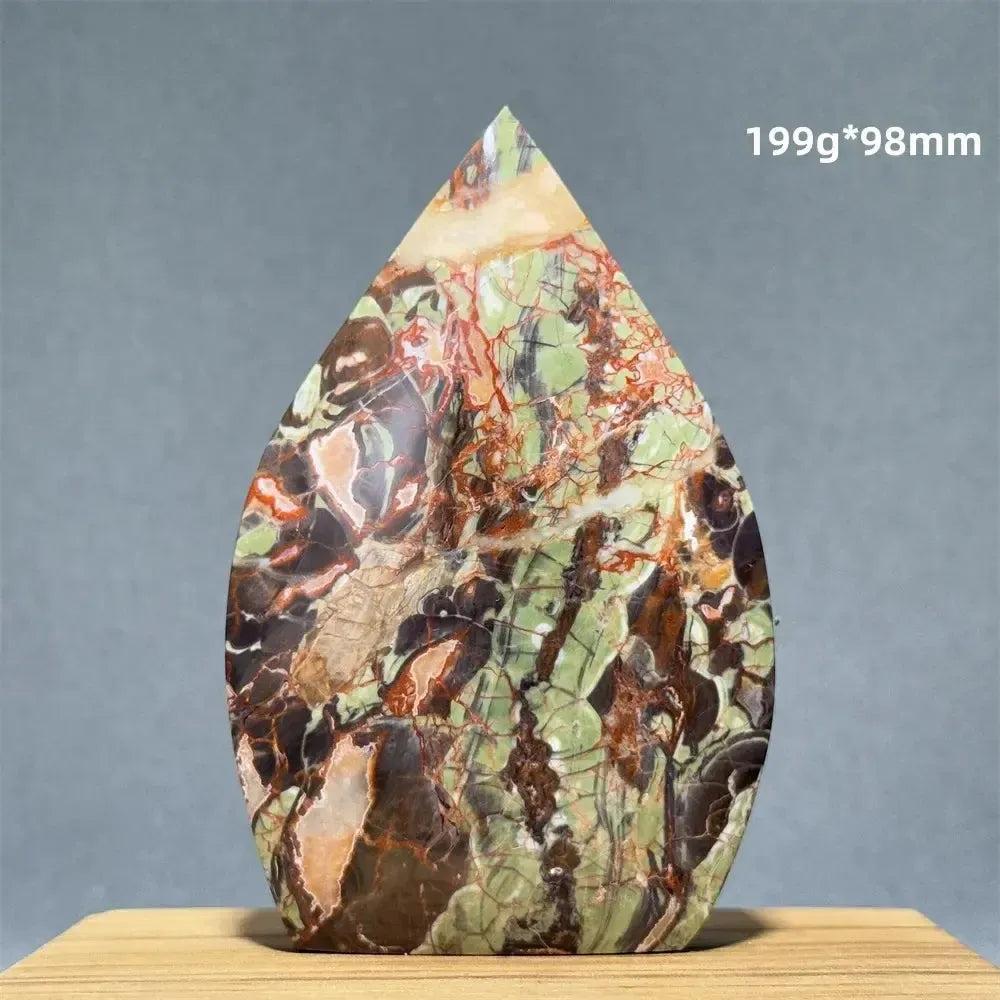 Moss Agate freeform torch from Crystal Destiny, featuring green, brown, and red dendritic inclusions.