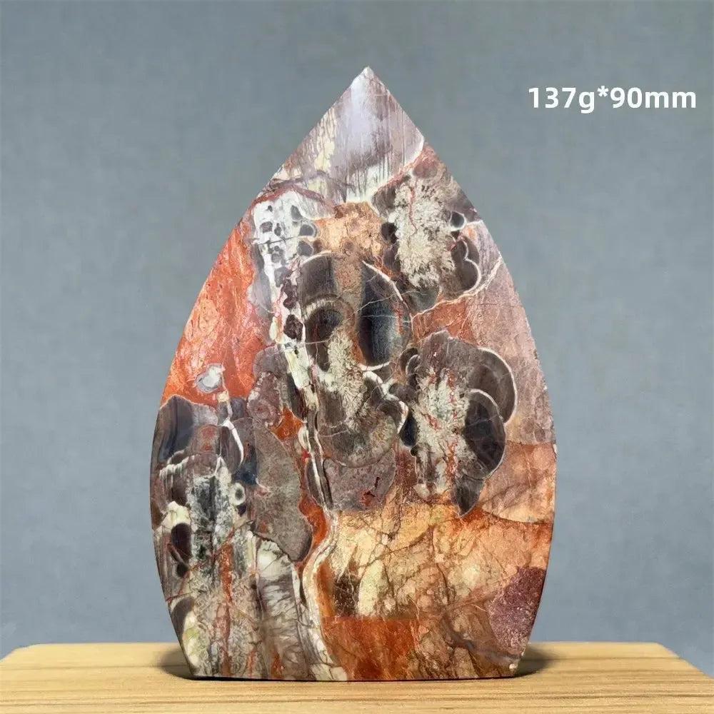 Red and brown petrified wood freeform torch, 137g, 90mm, by Crystal Destiny.