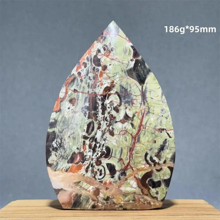 Natural Moss Agate freeform torch from Crystal Destiny, featuring green, brown, and red dendritic inclusions.