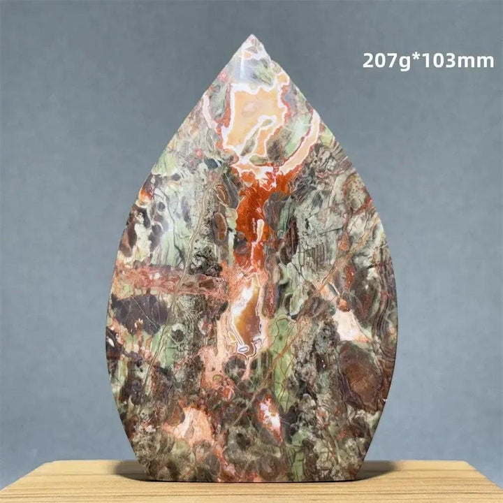 Natural Moss Agate freeform torch from Crystal Destiny, featuring green, orange, and brown dendritic inclusions.