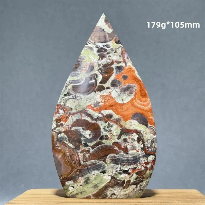 Moss Agate freeform torch from Crystal Destiny, featuring green dendritic inclusions and a natural upward energy flow.