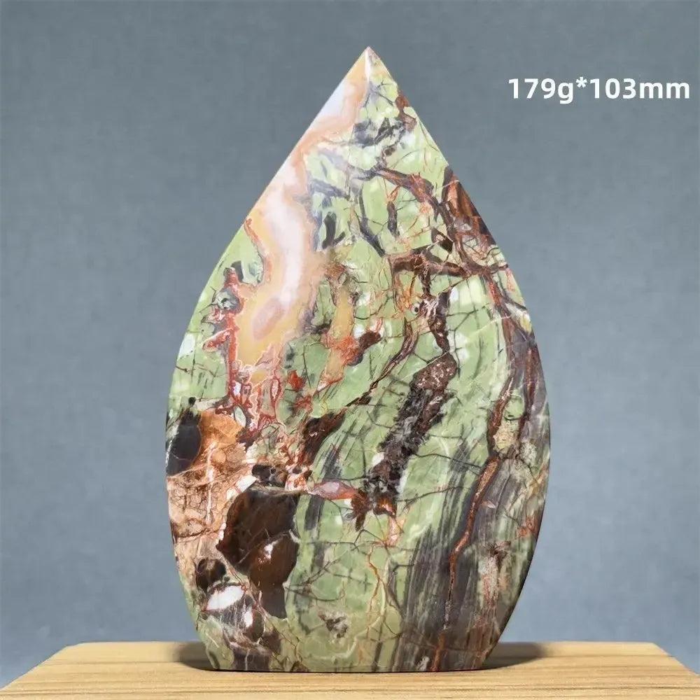 Moss Agate freeform torch from Crystal Destiny. Green, brown, and red dendritic inclusions. 179g, 103mm.