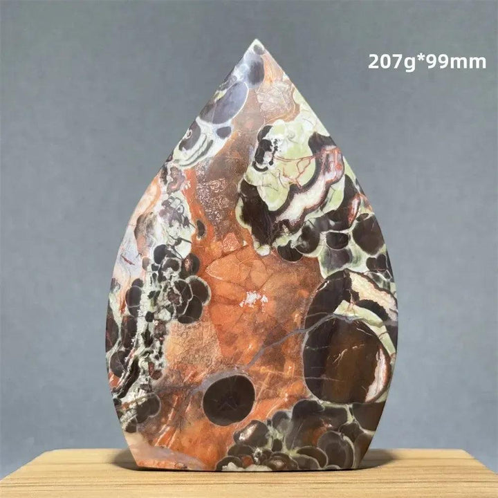 Crystal Destiny's Moss Agate freeform torch, a natural mineral specimen with green dendritic inclusions.