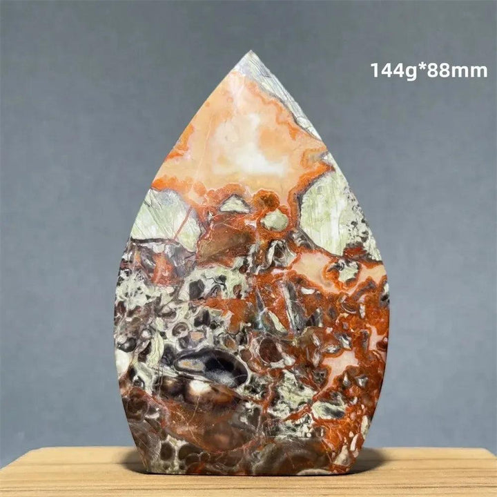 Moss Agate freeform torch from Crystal Destiny, featuring green, orange, and brown dendritic inclusions.