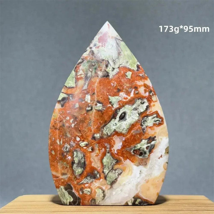 Moss Agate freeform torch from Crystal Destiny, featuring vibrant green and earthy red dendritic inclusions.