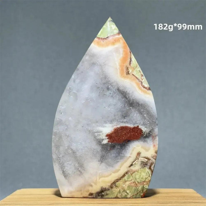 Moss Agate freeform torch from Crystal Destiny, featuring green, white, orange, and brown dendritic inclusions.