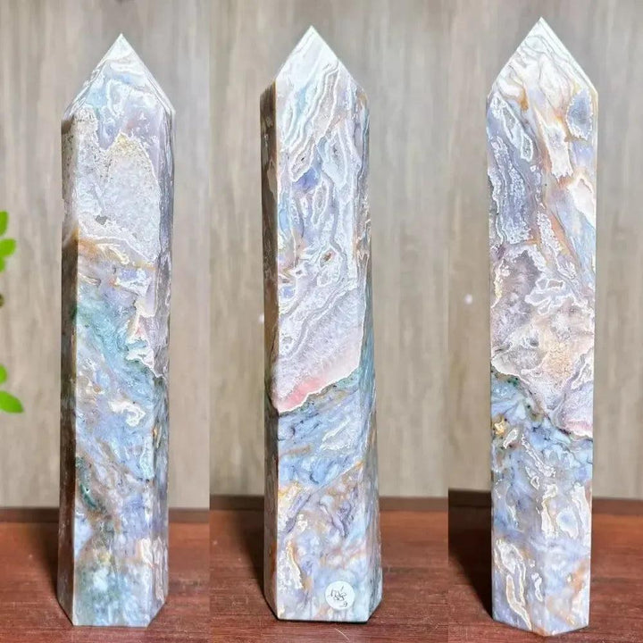 Moss Agate Ocean Jasper Crystal Tower: Polished, tall, hexagonal tower with lush green, blue, purple, and white patterns.