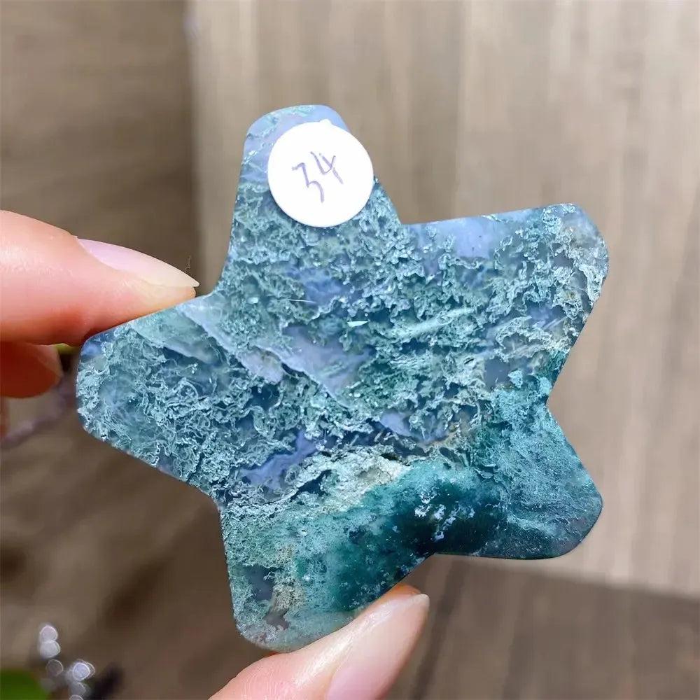 Hand-carved green and blue moss agate star crystal from Crystal Destiny, showing unique inclusions.