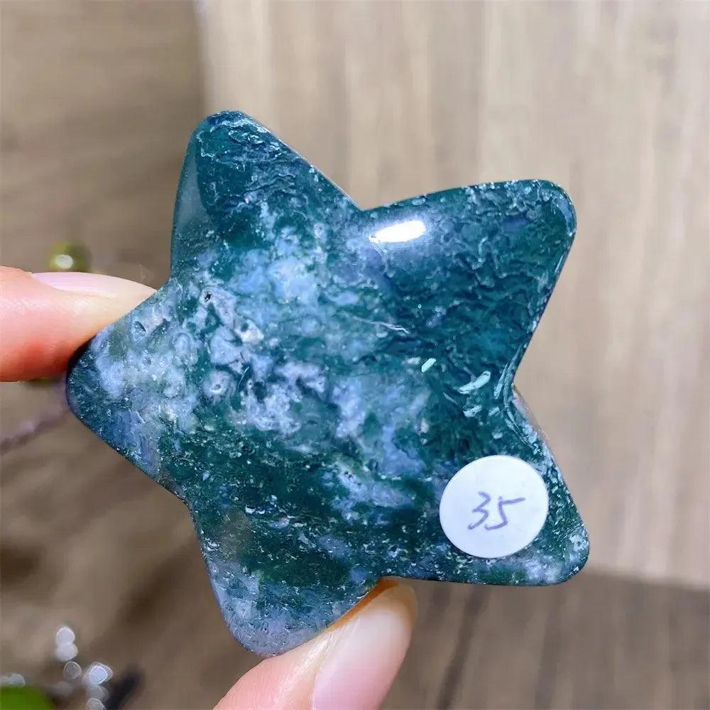 Hand-carved green moss agate star crystal from Crystal Destiny, showcasing unique forest-like inclusions.