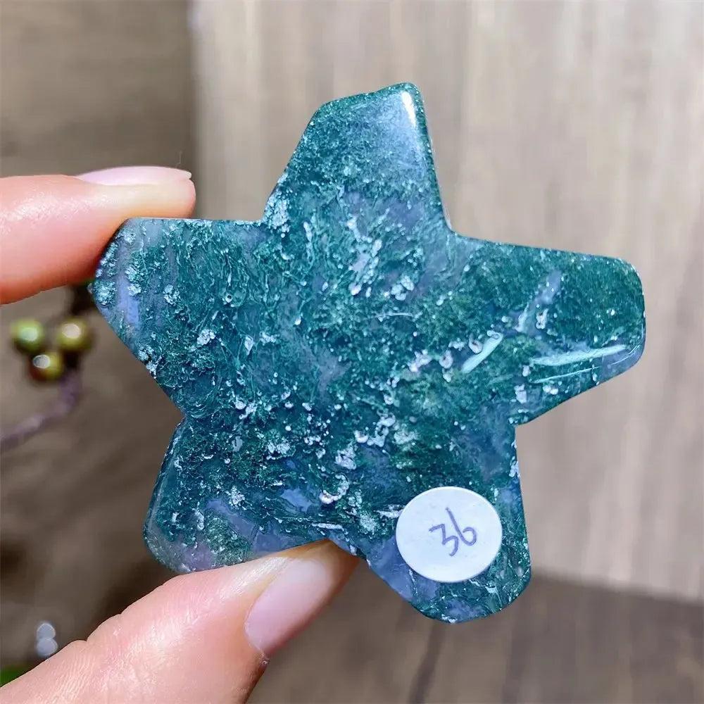 Hand-carved green moss agate star crystal from Crystal Destiny, showing unique forest-like inclusions.