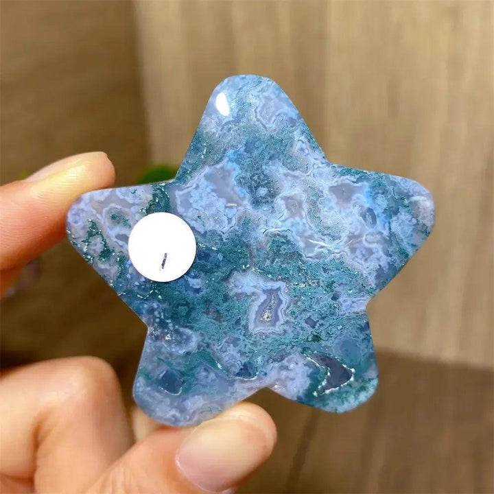 Hand-carved blue and green moss agate star crystal from Crystal Destiny, showcasing unique inclusions.
