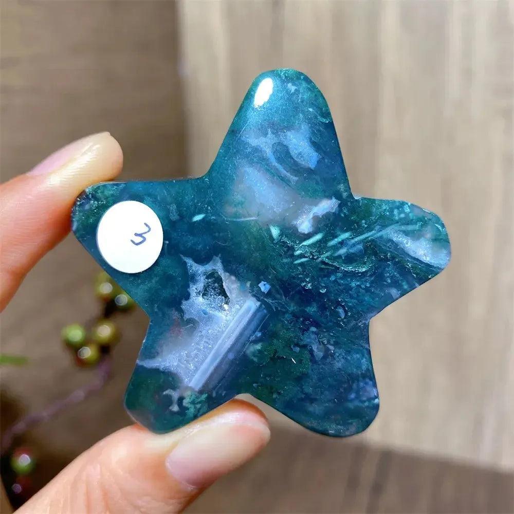 Hand-carved moss agate star crystal from Crystal Destiny, featuring deep green and blue inclusions.