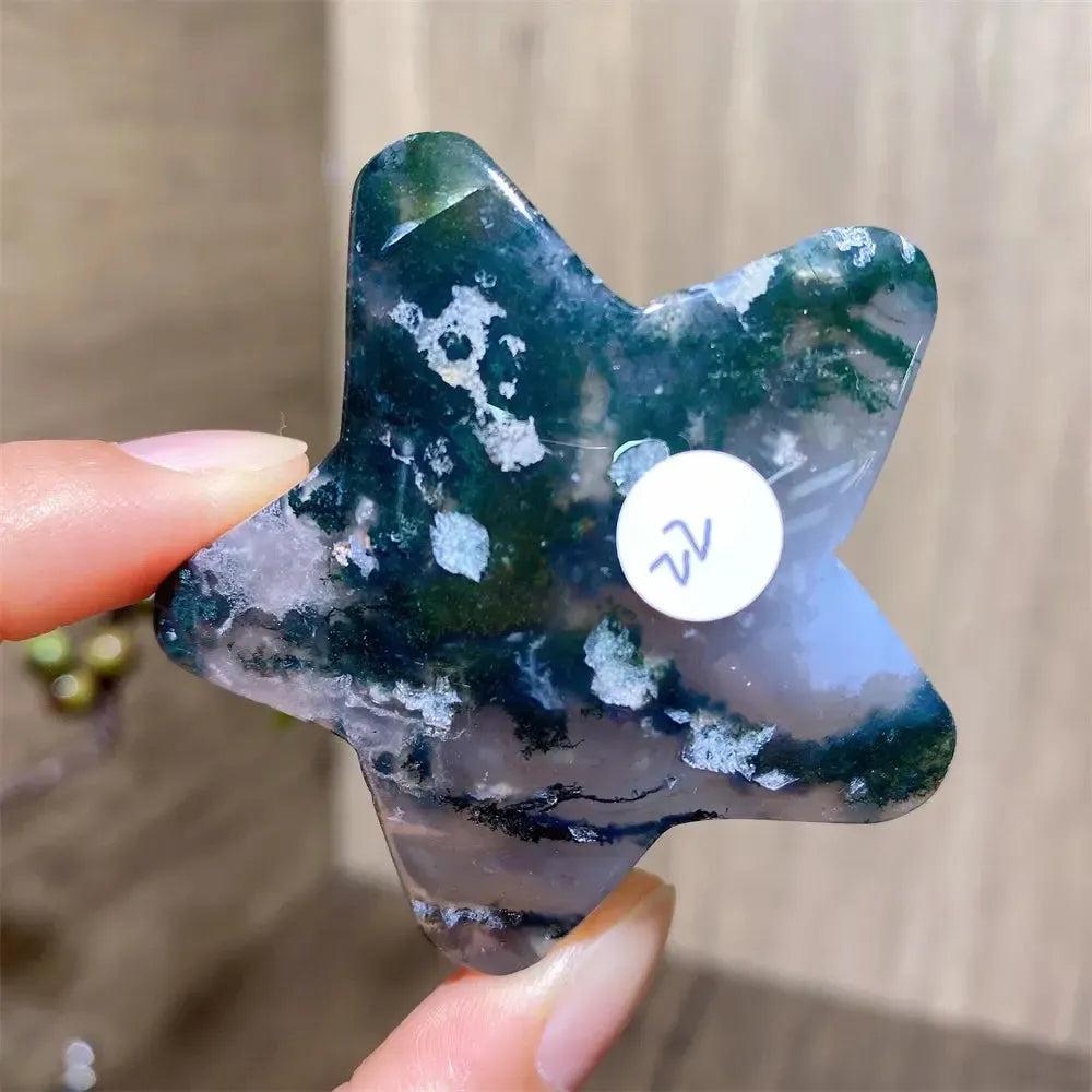 Hand-carved moss agate star crystal from Crystal Destiny, featuring deep green inclusions and white patterns.