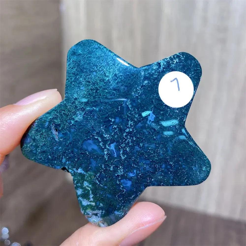 Hand-carved green moss agate star crystal from Crystal Destiny, showcasing deep green inclusions and natural patterns.