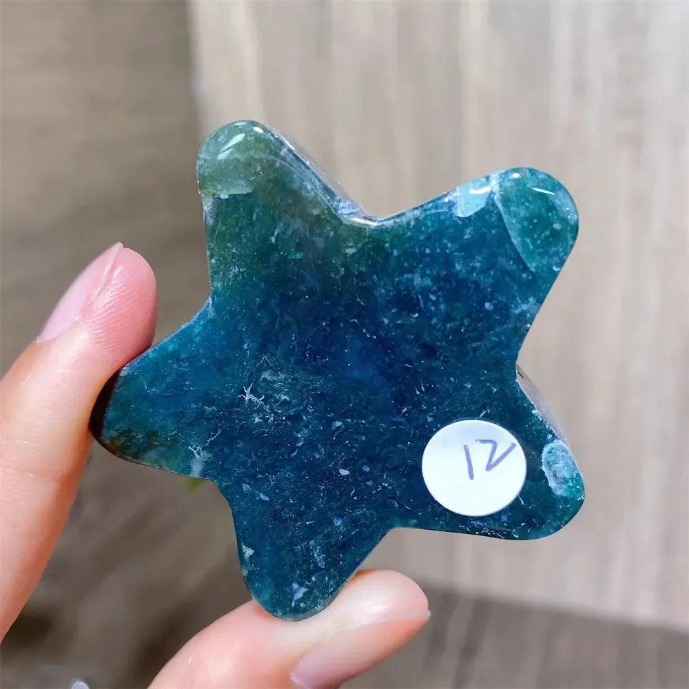 Hand-carved moss agate star crystal from Crystal Destiny, featuring deep green inclusions and polished finish.