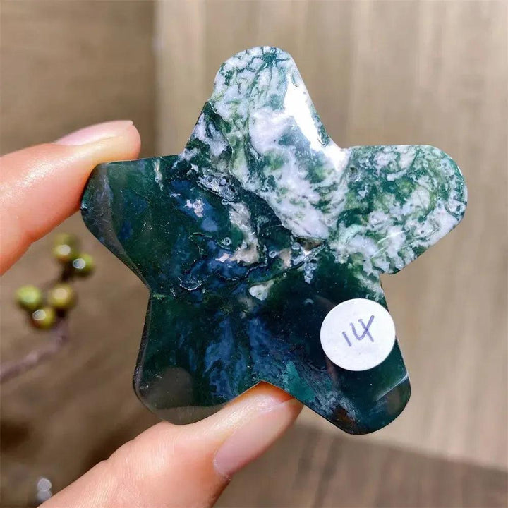 Hand-carved green moss agate star crystal from Crystal Destiny, showcasing unique white and deep green inclusions.