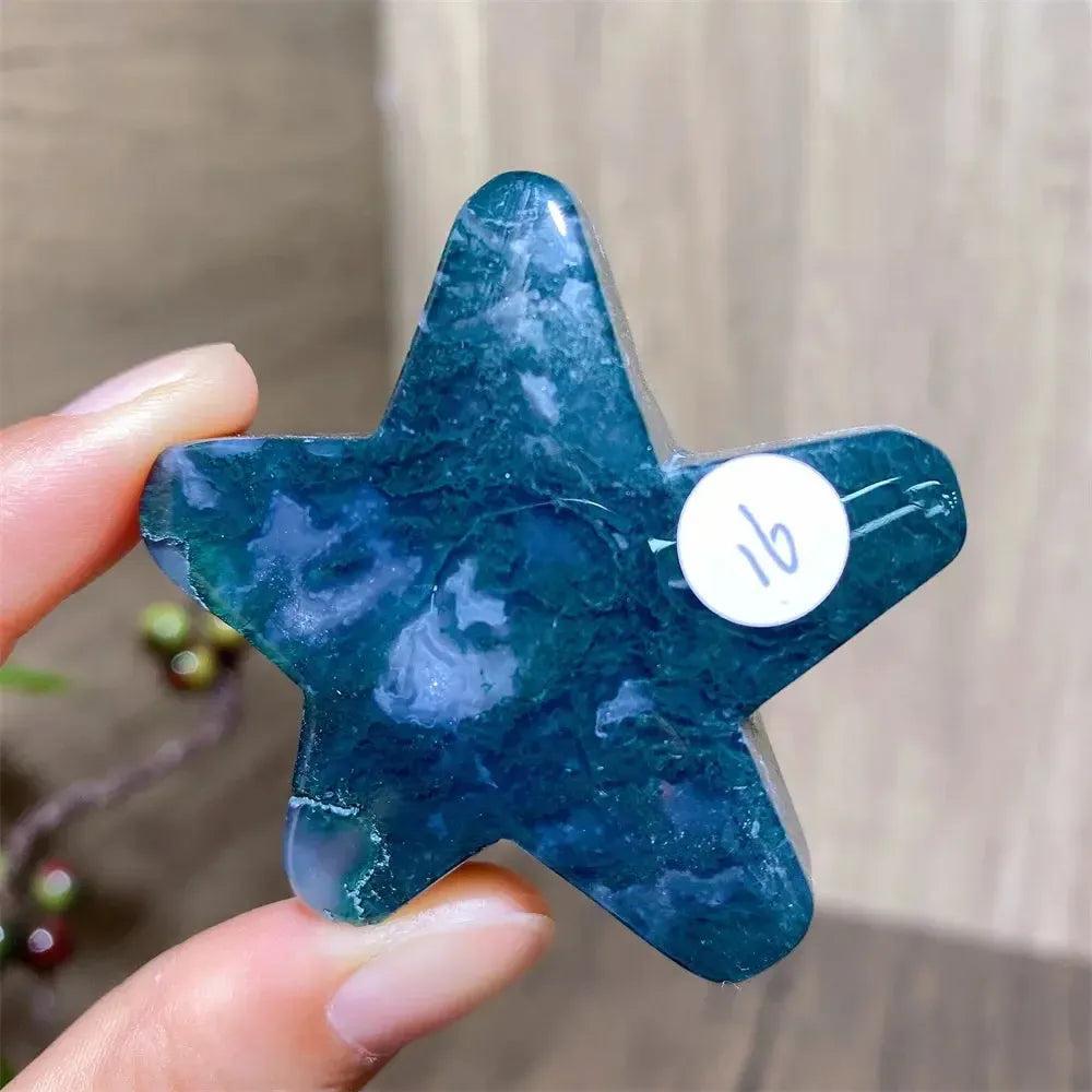 Hand-carved green moss agate star crystal from Crystal Destiny, showcasing unique inclusions and natural variations.