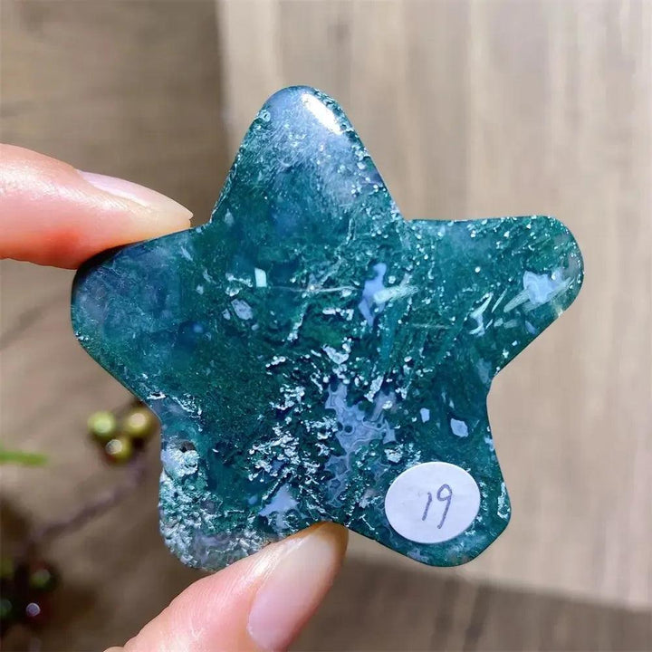 Hand-carved green moss agate star crystal from Crystal Destiny, showcasing unique forest-like inclusions.