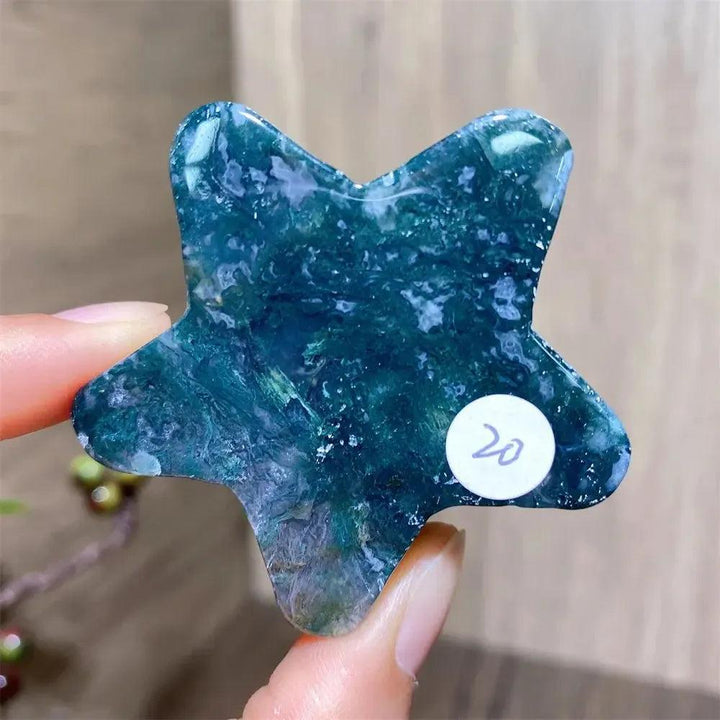 Hand-carved green moss agate star crystal from Crystal Destiny, showing unique forest-like inclusions.