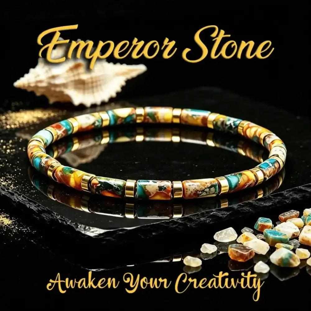 Multicolor Imperial Jasper Stone barrel bead bracelet with gold-tone spacers for creative intention and earthy style.