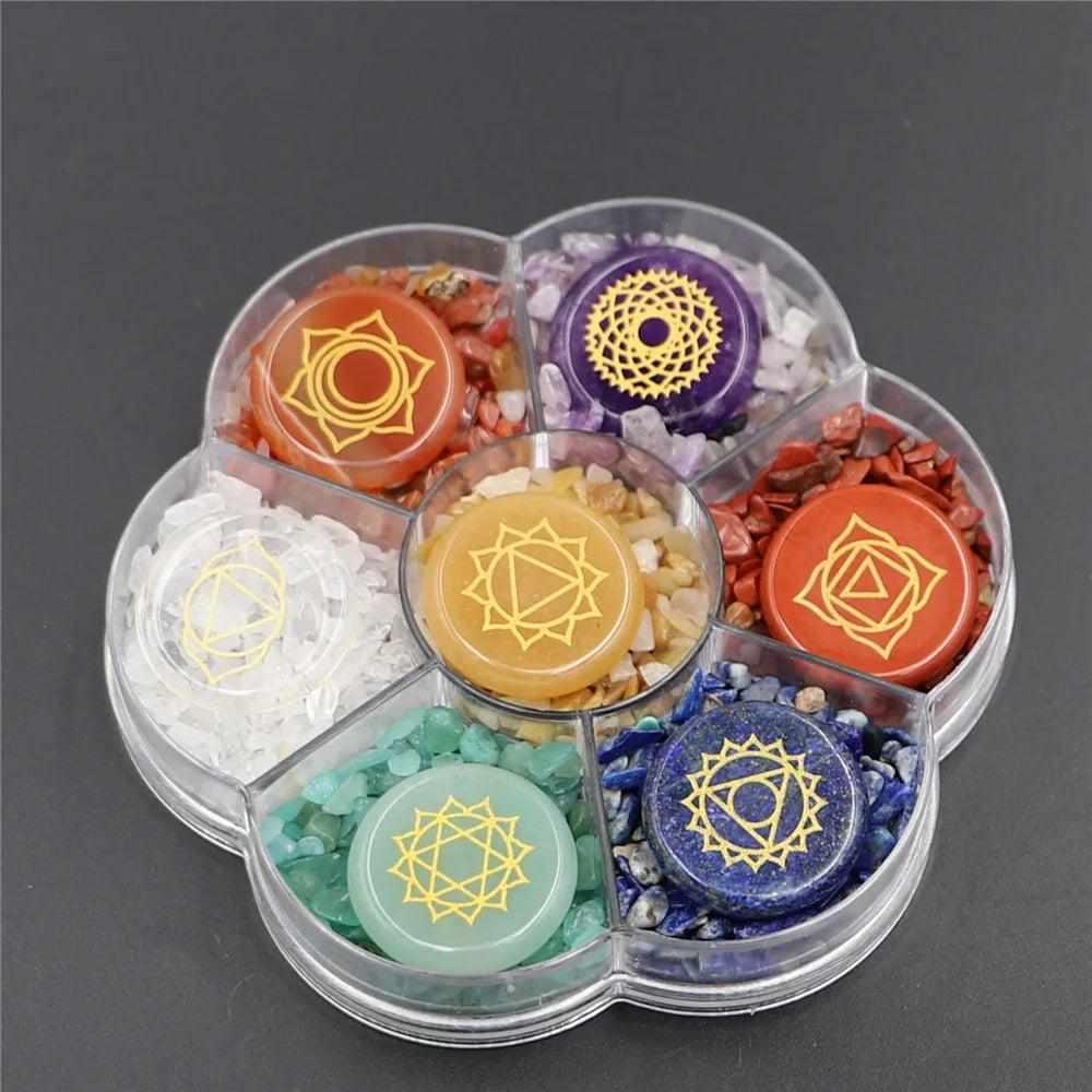 Natural 7 Chakra crystal coin and chip set with engraved symbols in a flower-shaped case for meditation and energy healing.