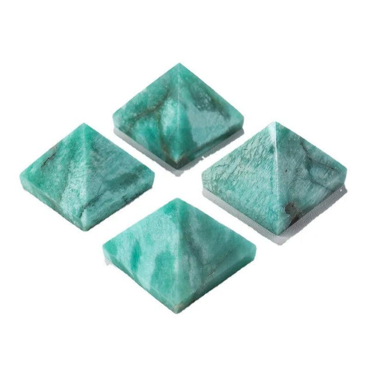 Four natural Amazonite Crystal Pyramids in varying soft blue-green hues for healing and calm.