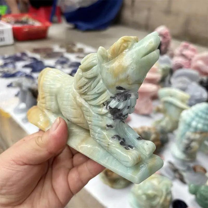 Polished Amazonite wolf carving in light green and beige, a healing stone animal figurine for home decor.
