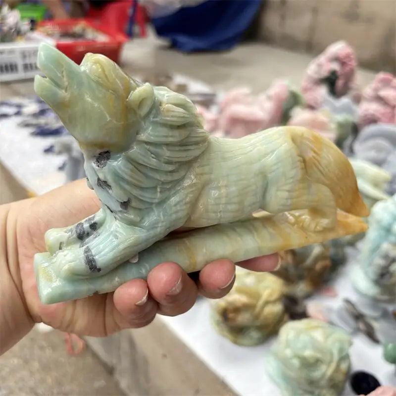 Polished Amazonite wolf carving in green and brown, a healing stone for home decor.